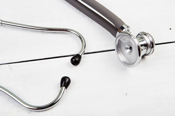 Medicine stethoscope on the white desk — Stock Photo, Image
