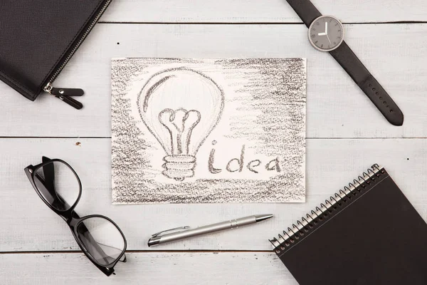 Idea concept - bulb drawn with pencil