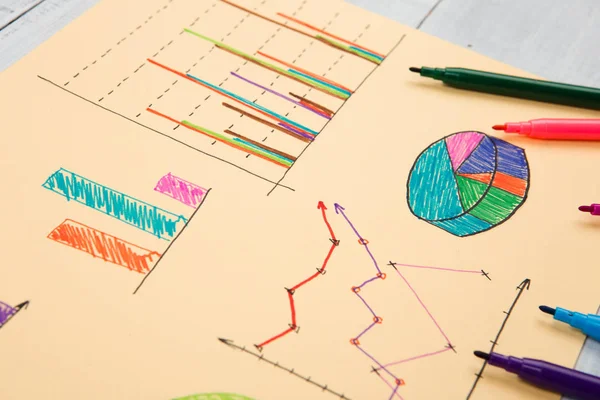 Financial graphs drawn with colored pens — Stock Photo, Image