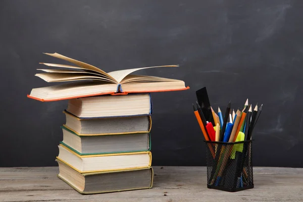 Education concept - books on the desk in the auditorium — Stock Photo, Image