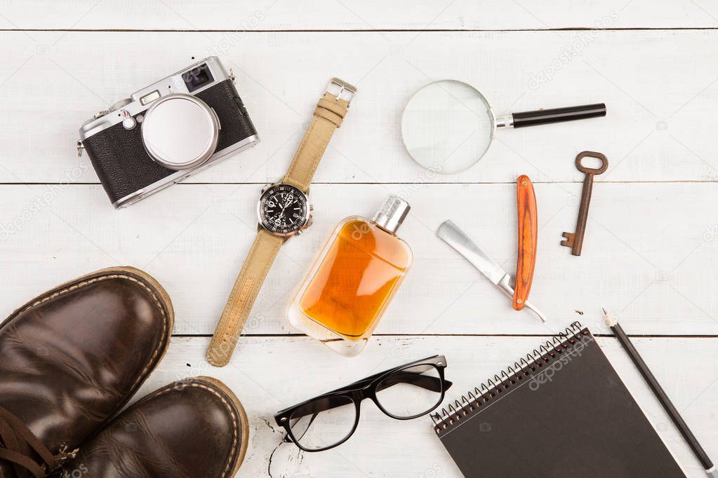 travel concept - set of cool stuff with camera and other things on wooden table