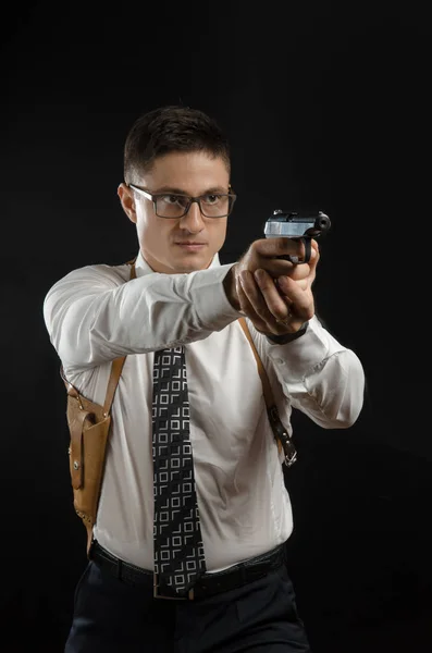 the man in a suit jacket with a gun posing as a special agent