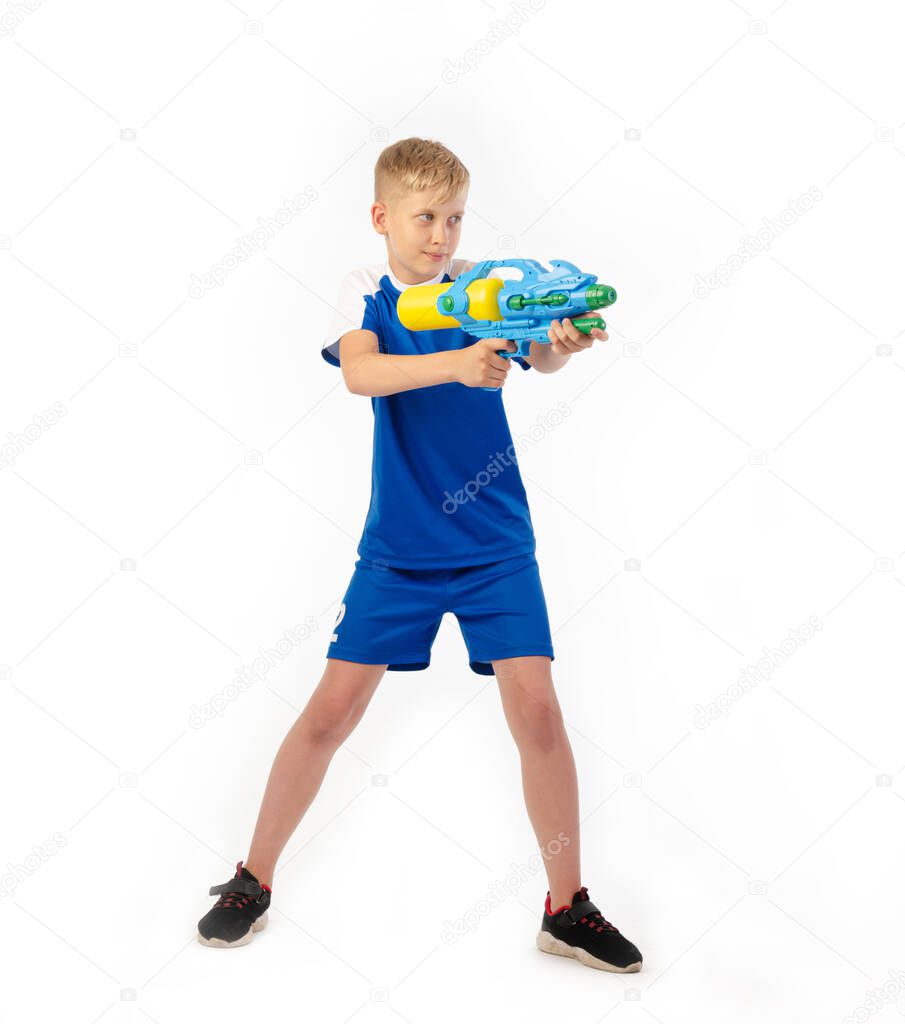 boy with water pistol on white background