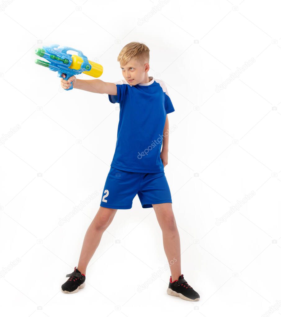 boy with water pistol on white background