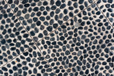 Siyah çakıl mozaiği ile döşenmiş Duvar