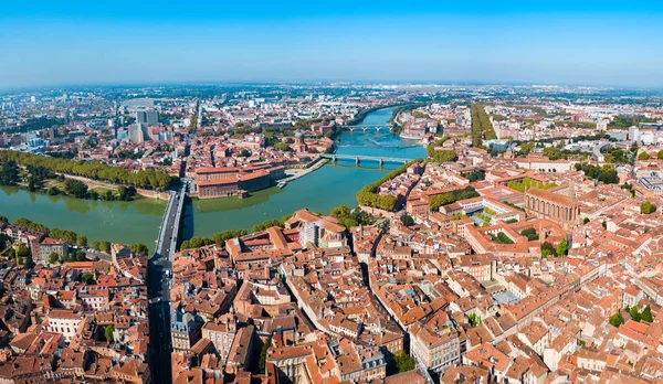 Toulouse and Garonne river aerial panoramic view. Toulouse is the capital of Haute Garonne department and Occitanie region in France.