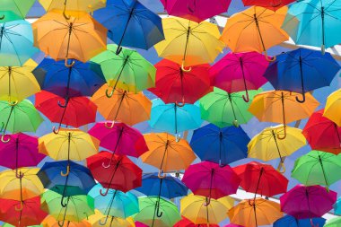Lots of umbrellas coloring the sky in the city of Agueda, Portugal clipart