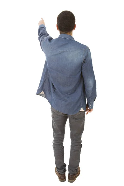 Genç Sıradan Bir Adam Beyaz Bir Arkaplanı Işaret Ediyor — Stok fotoğraf