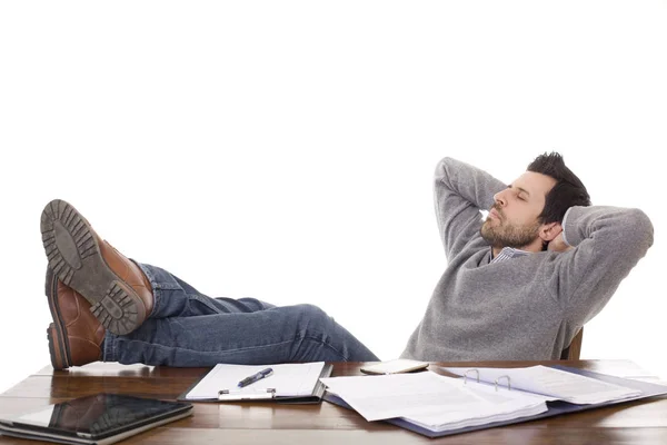casual man sleeping on a desk, isolated on white background