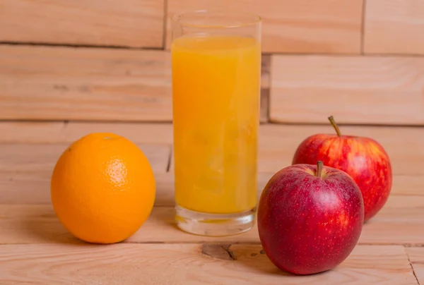 Variety of fruits and orange juice — Stock Photo, Image