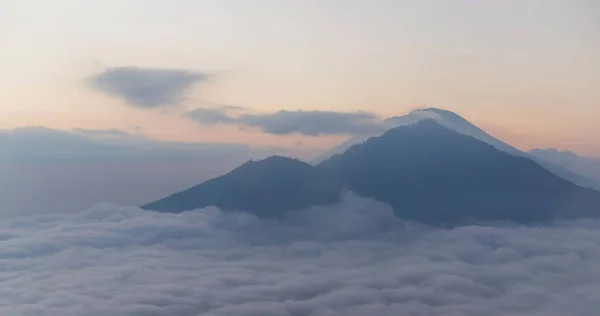 Scenic view of clouds and mist at sunrise from the top of mount Batur (Kintamani volcano), Bali, Indonesia