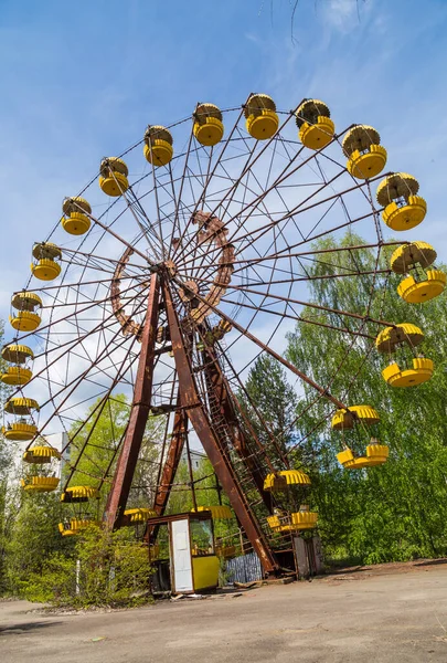 Old broken rusty metal radioactive electric wheel abandoned, the park of culture and recreation in the city of Pripyat, the Chernobyl disaster, Ukraine.