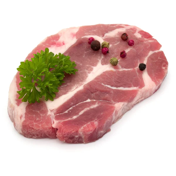 Raw pork neck chop meat with parsley herb leaves and peppercorn — Stock Photo, Image
