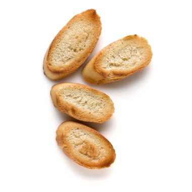 Beyaz arka plan üzerinde izole tost baget dilimleri kapatın. Tost, kızarmış ekmek parçaları. Üstten görünüm.