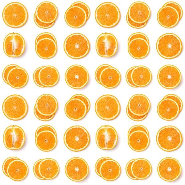 Seamless pattern of orange fruit slices. Orange slices isolated on white background. Food background. Flat lay, top view.