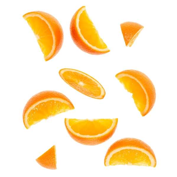 Falling fresh orange fruit slices isolated on white background c — Stock Photo, Image
