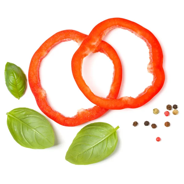 Red pepper slices with basil leaves isolated on white background — Stock Photo, Image