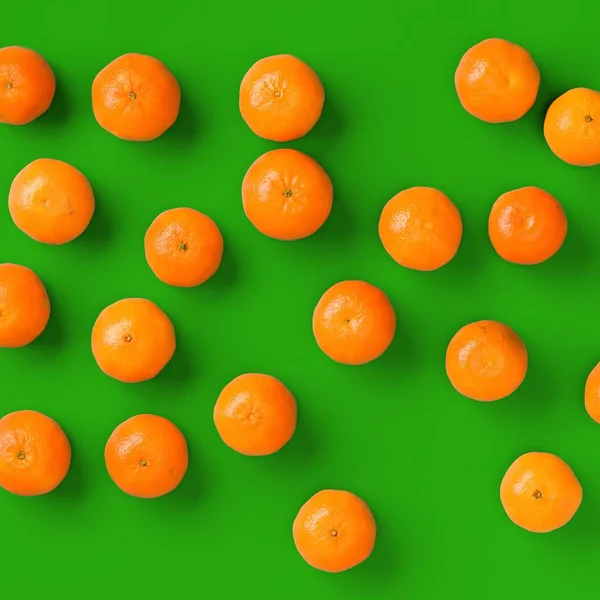 Fruit pattern of fresh orange tangerine or mandarin on green bac