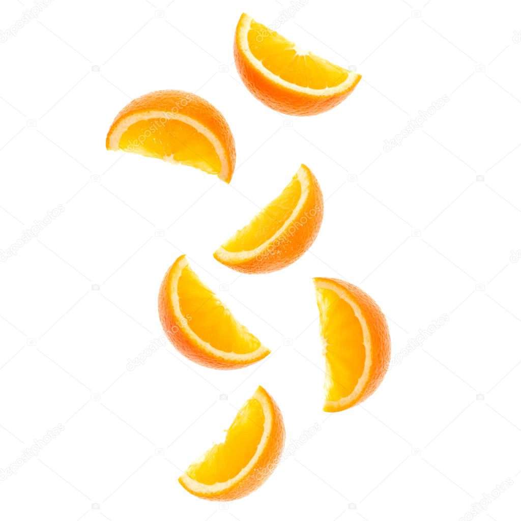 falling fresh orange fruit slices isolated on white background c
