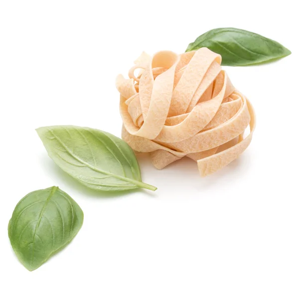 Italian pasta fettuccine nest and basil leaves  isolated on whit — Stock Photo, Image