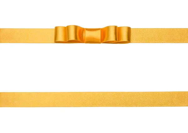 Świąteczny prezent złote wstążki i łuk na białym tle — Zdjęcie stockowe