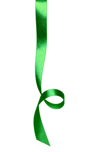 Shiny satin ribbon in green color isolated on white background .