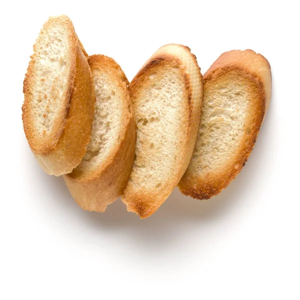 Rebanadas de baguette tostadas aisladas sobre fondo blanco de cerca . —  Fotos de Stock