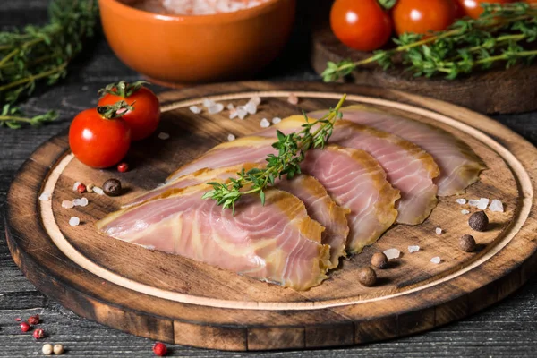 Cutting fish. Sturgeon. On dark background