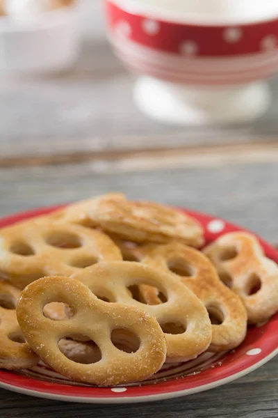 Sweet pretzels on a plate. Rustic style