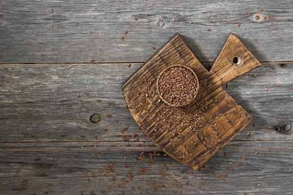 Semillas Lino Tazón Madera Sobre Una Mesa Madera Gris Estilo — Foto de Stock