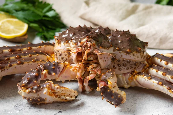 Kamchatka crab. King raw crab on the kitchen table. Kamchatka crab is on the table. Cooking process