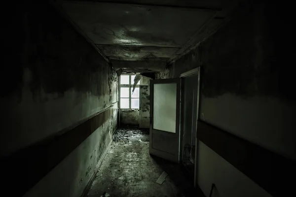 Dark and creepy corridor of abandoned building — Stock Photo, Image