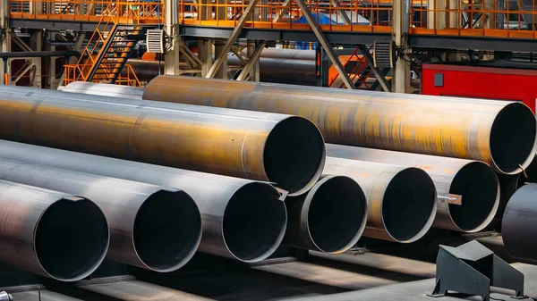 Black steel pipes for water or gas pipeline construction in ware — Stock Photo, Image