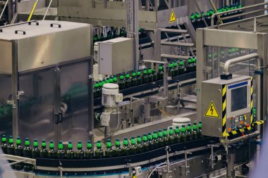 Modern automated beer bottling production line clipart