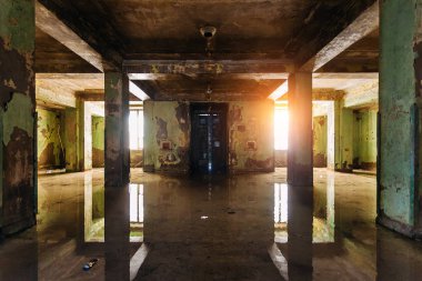 Dark rotten ruined flooded by rains abandoned building clipart
