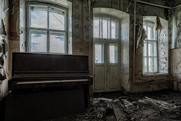 Old ruined abandoned building with broken piano