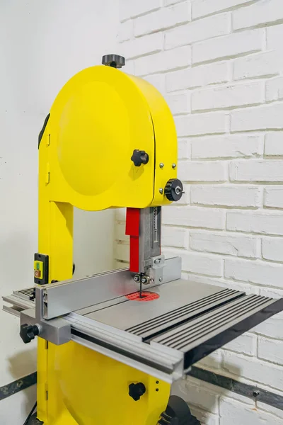 Modern band-saw cutting tool in workshop