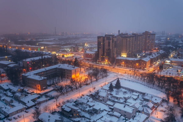 Fog, snowstorm at winter night in Voronezh. Aerial view, Voronezh cityscape.