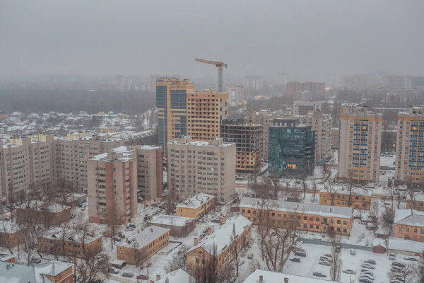 Fog, snowstorm at winter day in Voronezh. Aerial view.