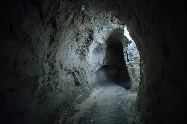 Dark underground passage of old chalky cave monastery — Stock Photo, Image