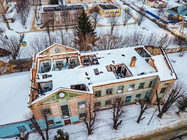 Aerial drone view of abandoned ruined building after fire and co — Stock Photo, Image