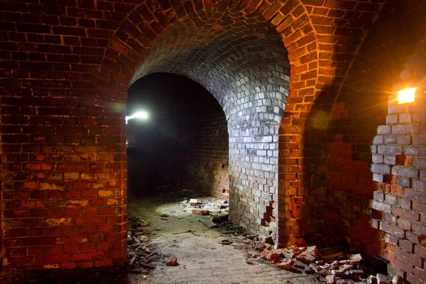 Dungeon under the old Prussian fortress illuminated by candles,