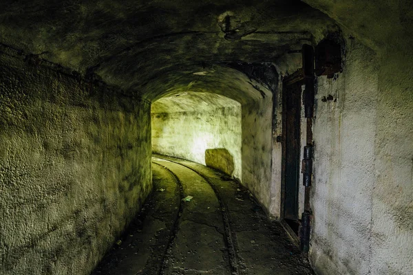 An abandoned warship ammunition transport tunnel with the remain — Stock Photo, Image