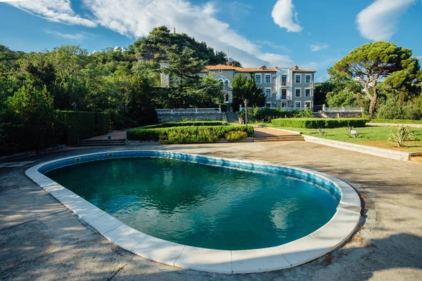 Small swimming pool in park near villa