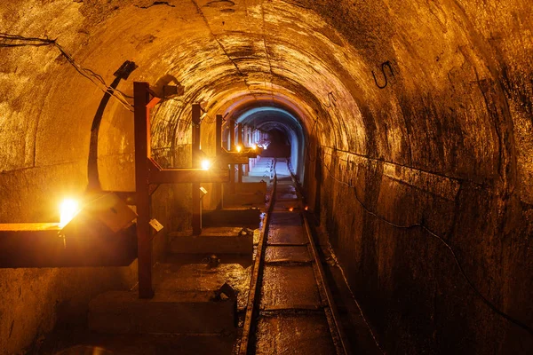 Round underground technical tunnel with a narrow-gauge railway — Stock Photo, Image