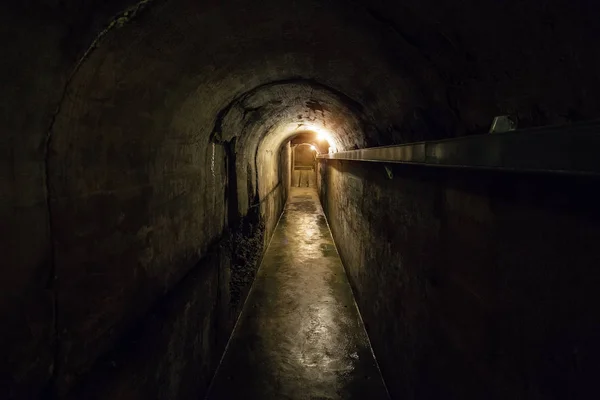 Tunnel of old underground Soviet bunker under military artillery — Stock Photo, Image