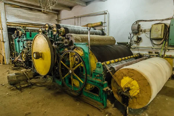 Felt boot production line. Wool processing machine. Carding of w