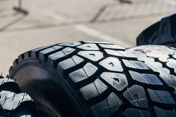 Clean new modern truck tire. Close up view of surface