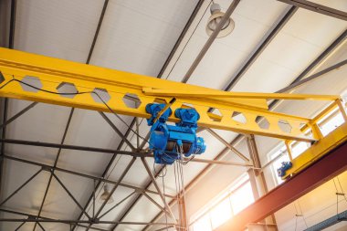 Industrial overhead crane in factory  clipart