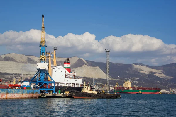 International sea port of Novorossiysk. Port cranes, barges, shi